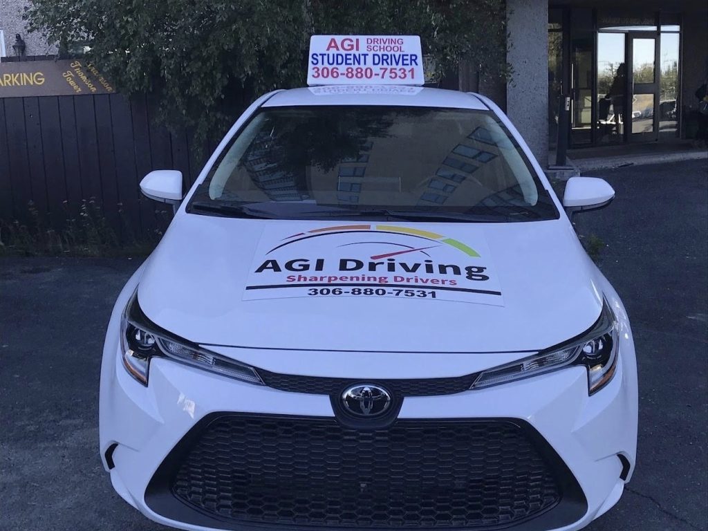 agi-driving-student-driver-car-with-sign-306-880-7531