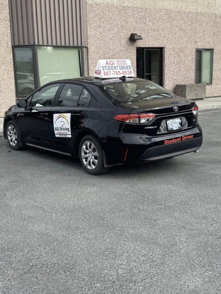 black toyota corolla student driver agi driving parking lot